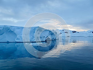 Iceberg reflections in calm waters of Lemaire Channel Antarctic Peninsula