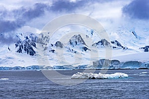 Iceberg Snow Mountains Blue Glaciers Dorian Bay Antarctica photo