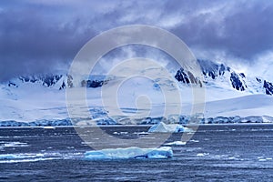 Iceberg Snow Mountains Blue Glaciers Dorian Bay Antarctica photo