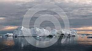 Iceberg at sunset. Nature and landscapes of Greenland. Disko bay. West Greenland. photo