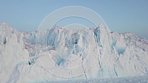 Iceberg at sunset. Nature and landscapes of Greenland. Disko bay. West Greenland. Summer Midnight Sun and icebergs. Big blue ice