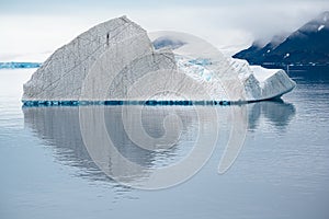 Iceberg with texture, lines and cuts, Antarctica. Typical foggy day in Antarctica.