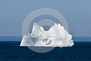 Iceberg with a Wave Crashing Through Large Hole, Newfoundland