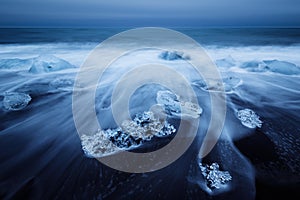 Icebergs beached on jokulsarlon beach in Iceland photo