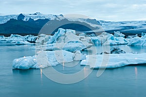 Icebergs with candles, Jokulsarlon ice lagoon before annual firework show, Iceland