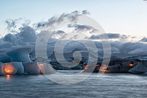 Icebergs with candles, Jokulsarlon ice lagoon before annual firework show, Iceland