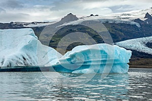 Icebergs in Fjallsarlon glacier lagoon, arctic landscape Iceland