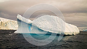 Icebergs floating around in the Errera Channel behind Cuverville Island, Antarctica.