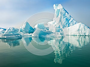 Icebergs Floating in Calm Water