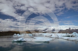 Icebergs floating on the river from the Jokulsarlon Glacier Lagoon to the ocean. Iceland