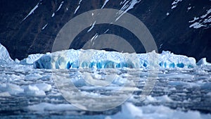 Icebergs in front of a rock face in Cierva Cove photo