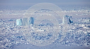 Icebergs in frozen Arctic Ocean