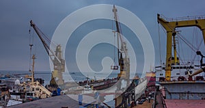 Icebreaker ship enters the floating dock for repair at shipyard. Tugboats haul ship for recontruction. Ship