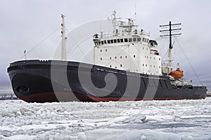 The icebreaker working in the fairway of the Gulf of Finland