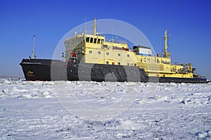 The icebreaker working in the fairway of the Gulf of Finland
