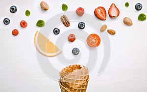 Icecreams with fruit and nut ingredients - ice cream cone on a white background