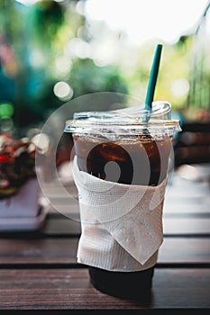 Iced Americano coffee on wood table