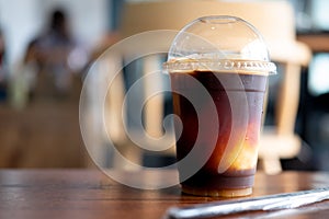 Iced black coffee or iced Americano mix orange smoothie. The fusion summer drink