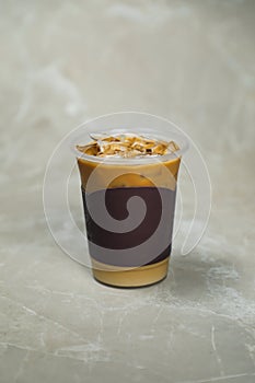 Iced Blended Caramel Coffee served in disposable cup isolated on grey background top view of cafe dessert
