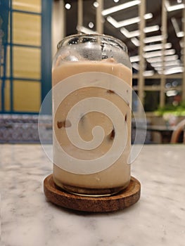 Iced Caffee Latte on Marble Table with Elegant Cafe Ambiance