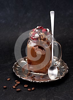 Iced coffee with chocolate ice cream and raspberries