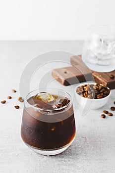 Iced Coffee, Cold Brew Coffee with Ice on Bright Background, Coffee Cocktail, Refreshing Beverage