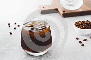 Iced Coffee, Cold Brew Coffee with Ice on Bright Background, Coffee Cocktail, Refreshing Beverage