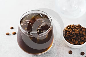 Iced Coffee, Cold Brew Coffee with Ice on Bright Background, Coffee Cocktail, Refreshing Beverage