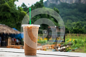Iced Coffee cup in coffee time on mountain view nature background. tourism and place for travel. coffee time at local cafe of