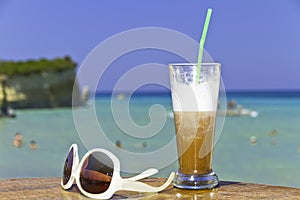 Iced coffee in an exotic beach