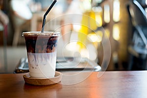 Iced coffee or latte macchiato in plastic glass