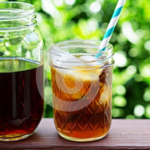 Iced coffee in mason jars outdoors