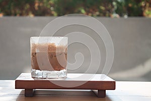Iced coffee with micro foam in coffee shop