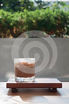 Iced coffee with micro foam in coffee shop