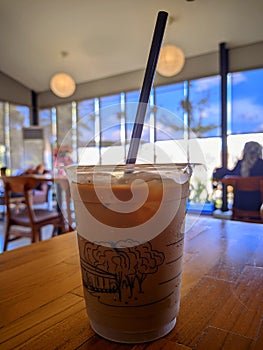 Iced coffee milk in plastic take away glass