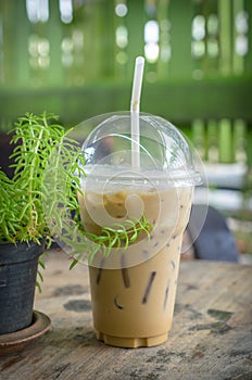 Iced coffee with milk is on the table.