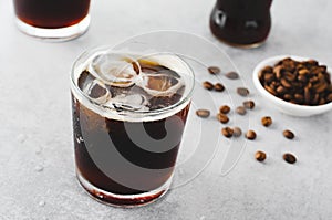 Iced Coffee, Sparkling or Cold Brew Coffee with Ice on Bright Background, Coffee Cocktail, Refreshing Beverage