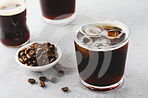 Iced Coffee, Sparkling or Cold Brew Coffee with Ice on Bright Background, Coffee Cocktail, Refreshing Beverage