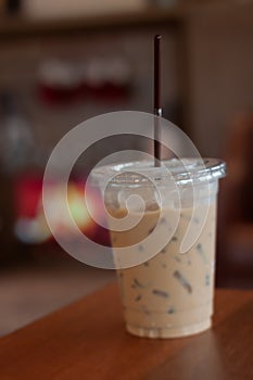 Iced coffee on wooden table