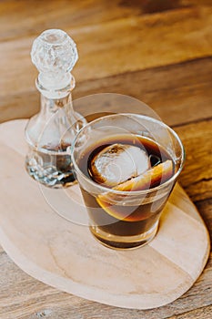 Iced cold brew coffee on wood tray