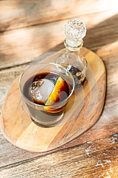 Iced cold brew coffee on wood tray