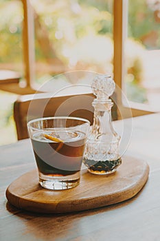 Iced cold brew coffee on wood tray