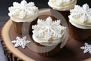 iced cupcakes, each with a unique snowflake design