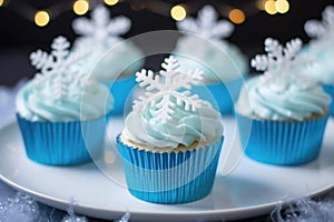 iced cupcakes, each with a unique snowflake design