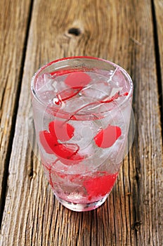 Iced drink with maraschino cherries