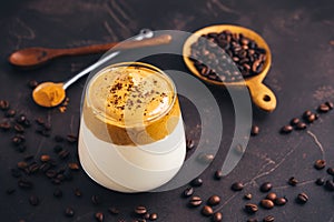 Iced fluffy creamy whipped trend drink with coffee foam and milk. Dalgona coffee photo