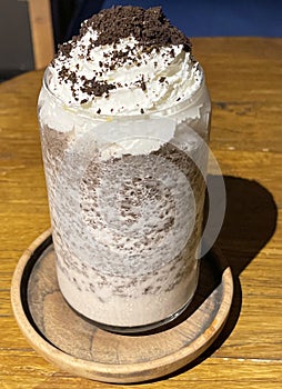 iced frappe chocolate drink with whipped cream on top and grated chocolate crunch