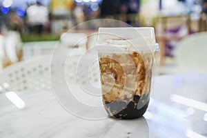 Iced fresh mlik with brown sugar syrup at cafe.