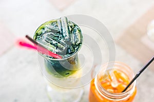 Iced Green Tea Coffee Late or Matcha & Espresso Fusion on the table