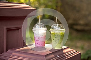Iced green tea matcha latte and Pink strawberry milk shake on summer